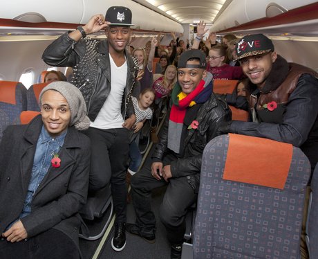 JLS on a plane with their fans