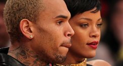 Rihanna and Chris Brown watching basketball togeth