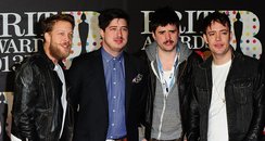 Marcus Mumford (second left), Winston Marshall (se