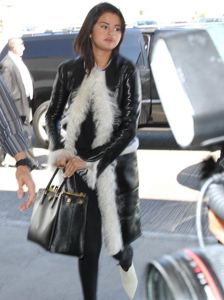 A faux-fur coat... in that LA sunshine? Selena Gomez is a brave lady ...
