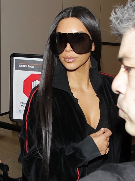 Back to work! Kim Kardashian heads to Dubai for her first international ...